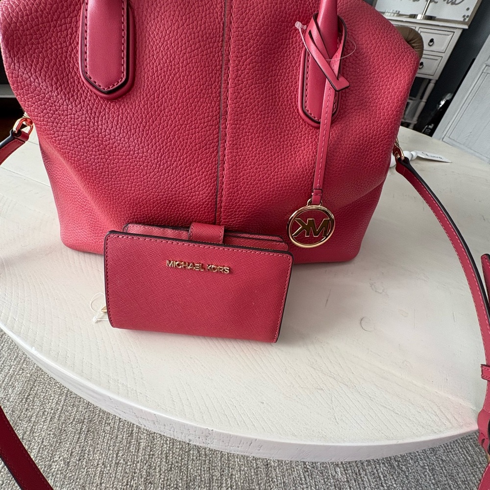 Michael Kors Pink Satchel with Gold Accents and matching wallet included.
